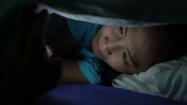 Asian Woman Playing Game Smartphone Bed Nighttime — Stock Video