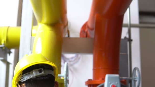 Asian engineer maintenance checking technical data of heating system equipment — Stock Footage Asian Engineer Maintenance Checking Technical Data Heating System Equipment Video Clip