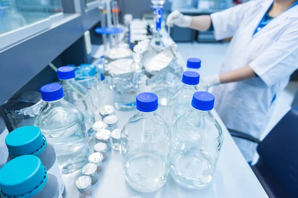 The scientists injected chemicals into plastic tubes, Scientist mix chemicals with The shake machine Before the experiment