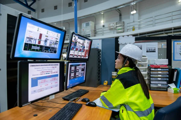 Inside the large Industry Factory, Female Computer Engineer Working on Personal Computer