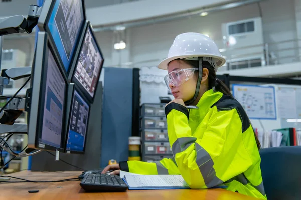 Inside the large Industry Factory, Female Computer Engineer Working on Personal Computer