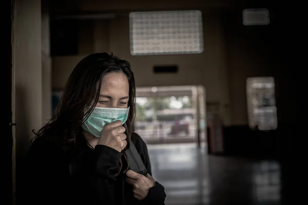 Asian traveler woman wear mask for protect coronavirus