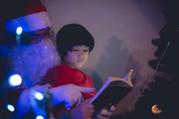Santa clause reading tale for kid at christmas festival  at home