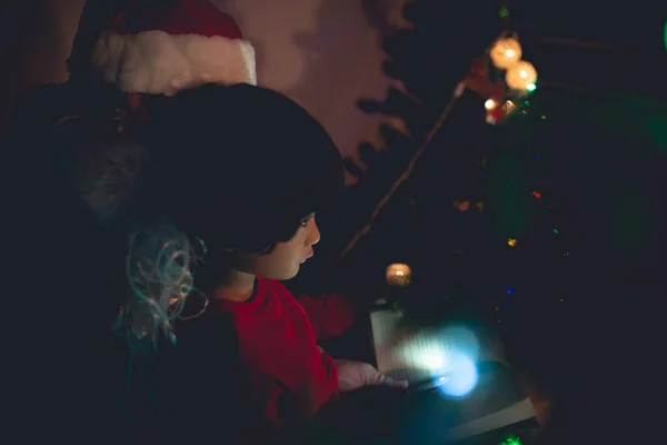 Santa clause reading tale for kid at christmas festival  at home