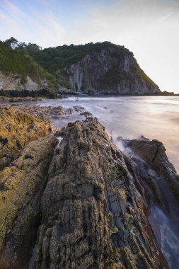 Asturias, sunset on the beach of Gueirua in the Cantabrian Sea