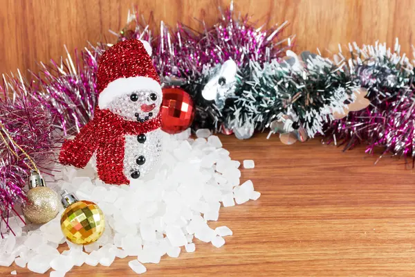 Snow Man on a pile of white crystalline — Stock Photo, Image