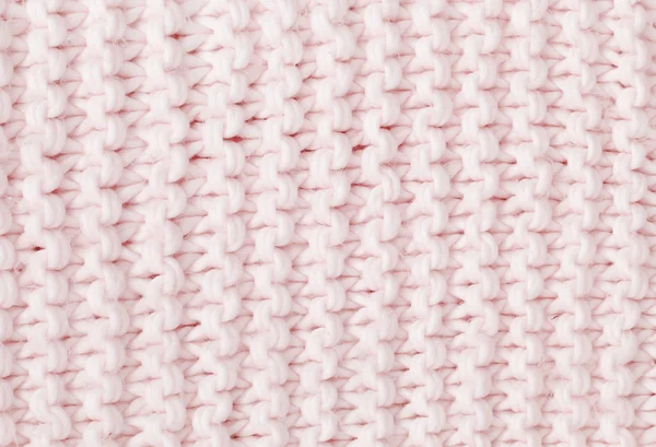 В'язаний текстурований м'яко-рожевий фон . — стокове фото