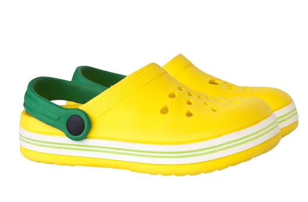 Pair yellow rubber kid 's shoes isolated . — стоковое фото