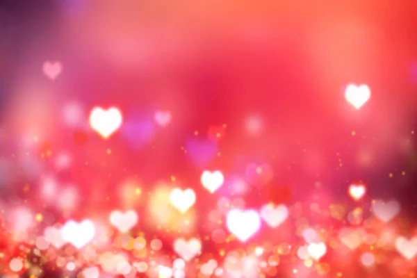 Brilhando corações desfocados fundo vermelho.Fundo de Valentim . — Fotografia de Stock