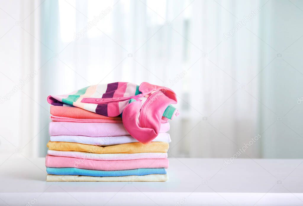 Stack of cotton colorful clothing,stacked clothes,kid's apparel.Cotton laundry.