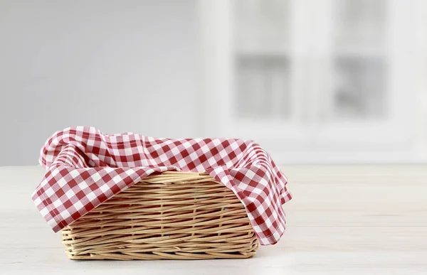 Empty straw basket with red checkered picnic cloth empty space food advertisement design,container.