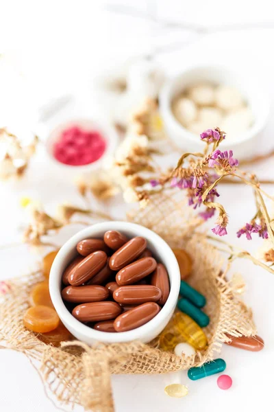 Nutritional supplements and vitamins for people health. Medicines on a white background.  Pills and supplements to support  people health.