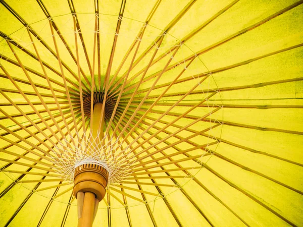 Thai Orient paper umbrella with bamboo stalks — Stock Photo, Image