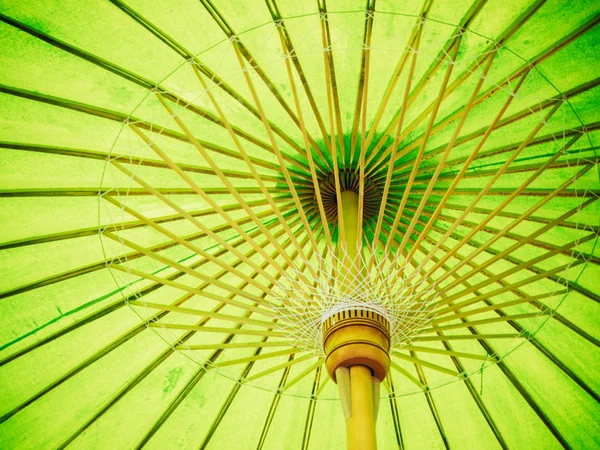 Thai Orient paper umbrella with bamboo stalks — Stock Photo, Image