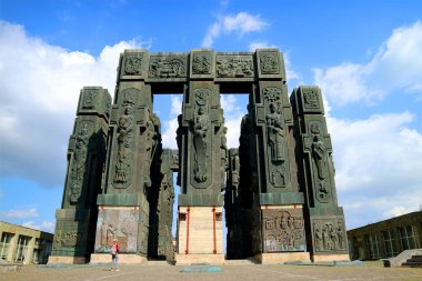 Man Looking Up to The Chronicle of Georgia or History Memorial of Georgia, a Massive 16 Pillars Approx. 30 M. Tall Monument near Tbilisi of Georgia