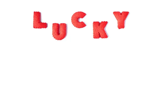 Parola Lucky Scritto Con Alfabeto Rosso Forma Biscotti Sfondo Bianco — Foto Stock