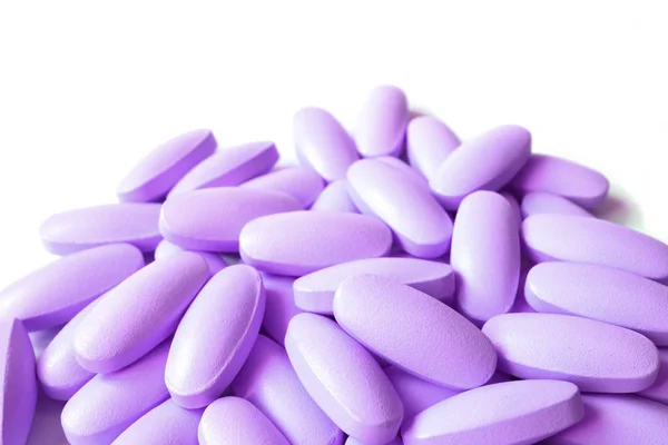 Stapel Van Lilac Paarse Kleur Ovale Vorm Supplement Pillen Witte — Stockfoto