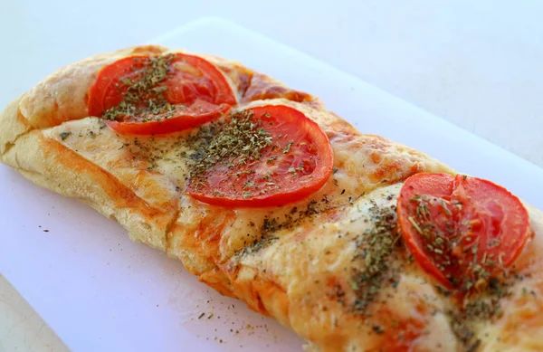 Pizza toast with tomato and oregano herb