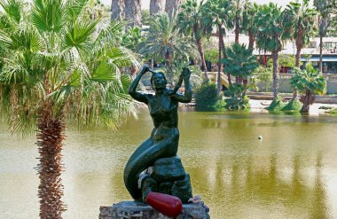 Mermaid Statue of Huaca China, Beautiful Princess in the Legend of this Oasis Town Who Gave Birth to the Lagoon, Huacachina, Ica, Peru clipart