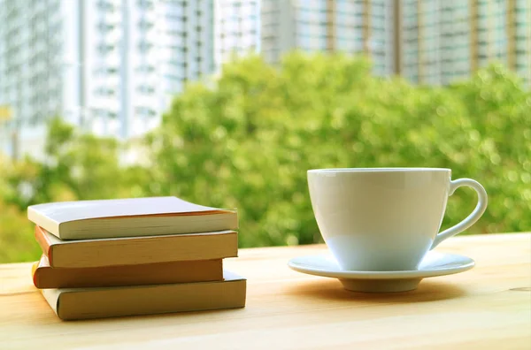 Stack Books Cup Hot Drinks Table Window Blurred Green Foliage — Stock Photo, Image