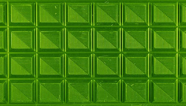 Top View of Chocolate Bar in Vivid Green Color for Background, Banner, Pattern