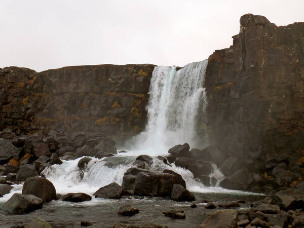 Oxararfoss Waterfall under the Autumn Cloudy Sky, Thingvellir National Park, Golden Circle, Iceland
