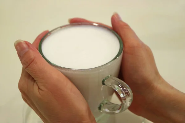Two Hands Holding Cup Warm Milk Served Transparent Glass Cup — Stock Photo, Image