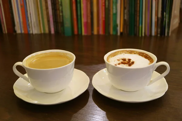 Black Coffee Cappuccino Coffee Blurry Rows Books Background — Stock Photo, Image