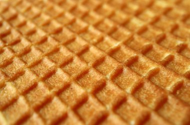 Geleneksel Hollanda tatlılarının kapalı dokusu, seçici arka plan odaklı Stroopwafel