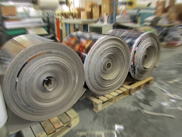 cardboard rollers covered with transparent cellophane from the printing process