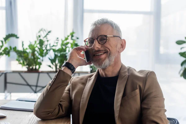 Cheerful Businessman Glasses Talking Smartphone Office — Stock Photo, Image