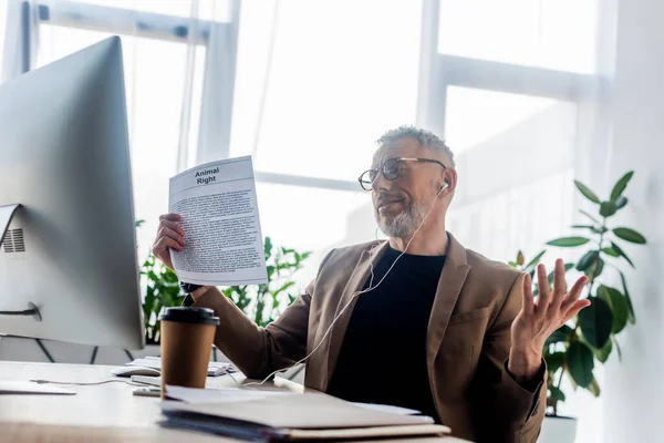 Selective Focus Businessman Glasses Earphones Holding Document Animal Right Lettering — Stock Photo, Image