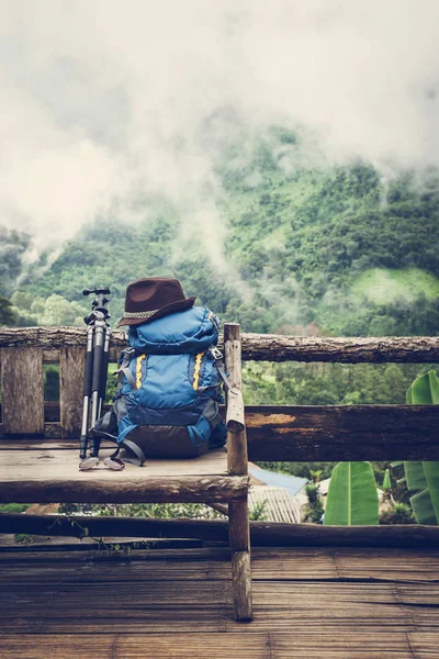 Travel backpack on the wooden bench — Stock Photo, Image