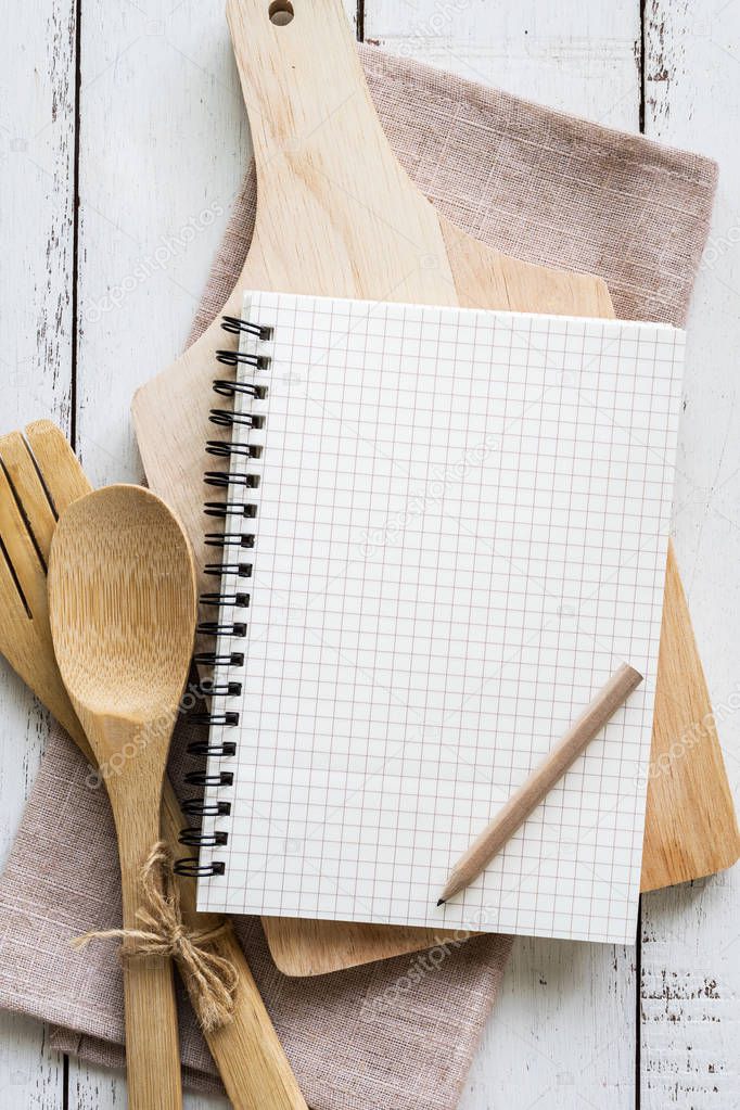 Blank notebook with wooden utensil