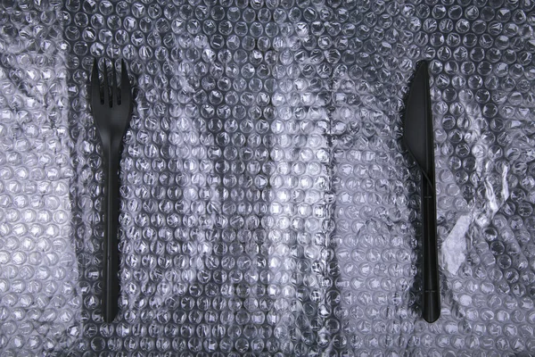 Black plastic knife and fork