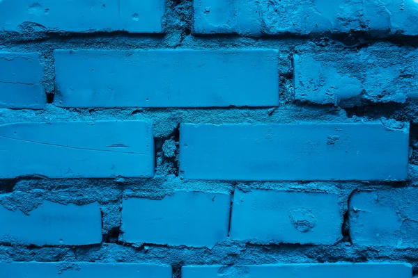 Old brick blue wall. Color of the year 2020. Classic bue