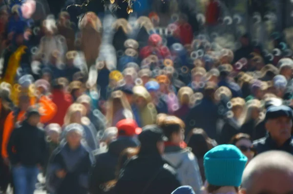 Blurred background. People walk in the recreation Park.