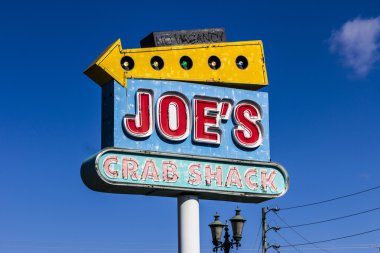 Indianapolis - Circa October 2016: Joe's Crab Shack Local Signage. Joe's Crab Shack is a chain of beach-themed seafood casual dining restaurants owned by Ignite Restaurant Group I clipart