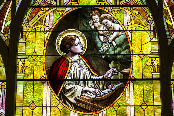 Kokomo - Circa November 2016: Church Stained Glass Portraying Cherubs and Saint Cecilia, the Patron Saint or Patroness of Musicians I