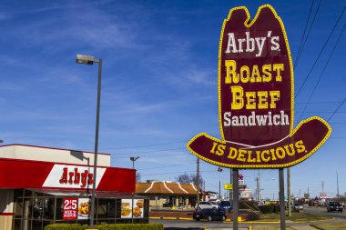 Indianapolis - Circa February 2017: Arby's Retail Fast Food Location. Arby's operates over 3,300 restaurants III clipart