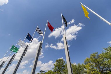Indianapolis - Circa May 2017: The seven racing flags at Indianapolis Motor Speedway. IMS Prepares for the 101st Running of the Indy 500 V clipart