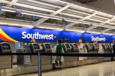 Indianapolis - Circa July 2017: Southwest Airlines Check In desk preparing passengers for departure. Southwest is the largest low-cost carrier in the world IV clipart