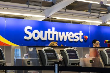 Indianapolis - Circa July 2017: Southwest Airlines ticket counter preparing passengers for departure. Southwest is the largest low-cost carrier in the world III clipart
