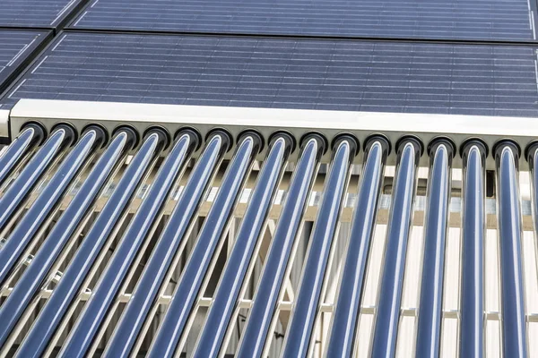 Solar Thermal Flat Panels with Evacuated Tube Collectors. Many companies are installing renewable energy sources to reduce their carbon footprint II