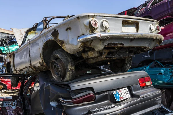 Indianapolis - Circa September 2017: Stacked junk yard Corvair and Impala prepared for crushing to be recycled I — Stock Photo, Image