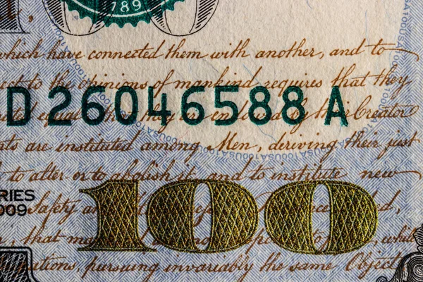 Closeup of the golden 100 and script on a one hundred dollar bill for background V — Stock Photo, Image