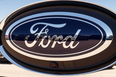 Lafayette - Circa April 2018: Ford Oval tailgate logo on an F-150 pickup truck. Ford sells products under the Lincoln and Motorcraft brands XIV clipart