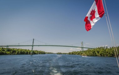 Cruising the Thousand islands under the Canadian flag clipart