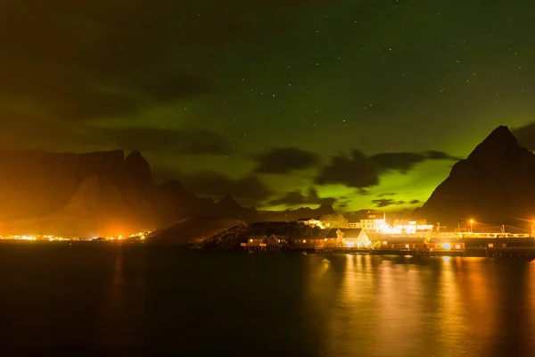 Dramatic polar lights, Aurora borealis over the mountains in the North of Europe - Lofoten islands, Norway