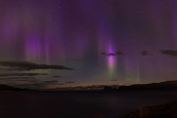 Aurora borealis, dramatic polar lights over the mountains in the North of Europe - Lofoten islands, Norway